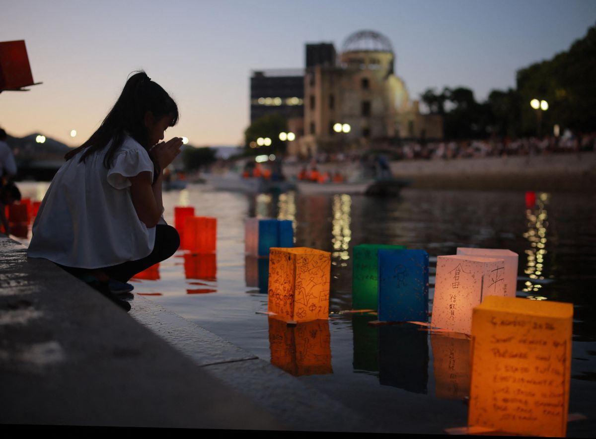 Lanterns are floated on the Motoyasu River in memory of the victims of the atomic bombing in front of the Atomic Bomb Dome in Hiroshima City, Hiroshima Prefecture, Japan, on August 6, 2026, the 81st anniversary of the U.S. atomic bombing of Hiroshima. Tens of thousands of civilians were killed when the United States dropped an atomic bomb on the city on August 6, 1945. The city estimates that about 140,000 people had died by the end of 1945. As of this year, the names of 353,639 victims are recorded on the city's registry of atomic bomb victims. ( The Yomiuri Shimbun ) (Photo by Yukia Watanabe / The Yomiuri Shimbun via AFP)