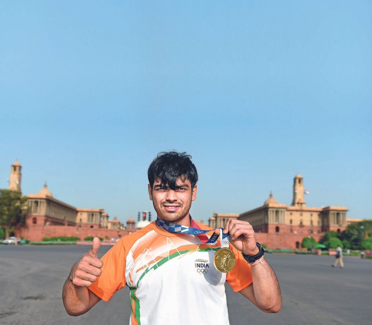 Olympic gold medallist and soldier Neeraj Chopra while showing his gold medal talks about respecting the national flag, the discipline of the Army, and why he is determined to stay rooted amidst his newfound fame on Independence day, in New Delhi on August 15, 2021. The Times of India/ Ranjit Kumar. (Photo by Ranjit Kumar / The Times of India via AFP)