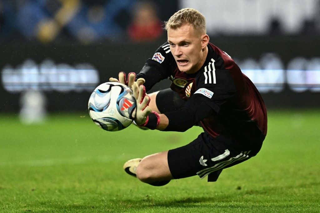 Hungary's goalkeeper #01 Balazs Toth saves the ball during the UEFA Nations League Group B2 football match between Ukraine and Hungary in Trnava, Slovakia on October 5, 2026. (Photo by Joe Klamar / AFP)