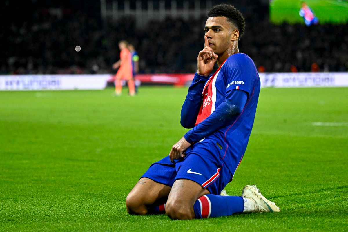 PSG's French forward #14 Desire Doue celebrates after scoring his team's first goal during the UEFA Champions League first round day 3 football match between Paris Saint-Germain (PSG) and FC Barcelona at the Parc de Princes stadium in Paris on October 20, 2026. (Photo by JULIEN DE ROSA / AFP)