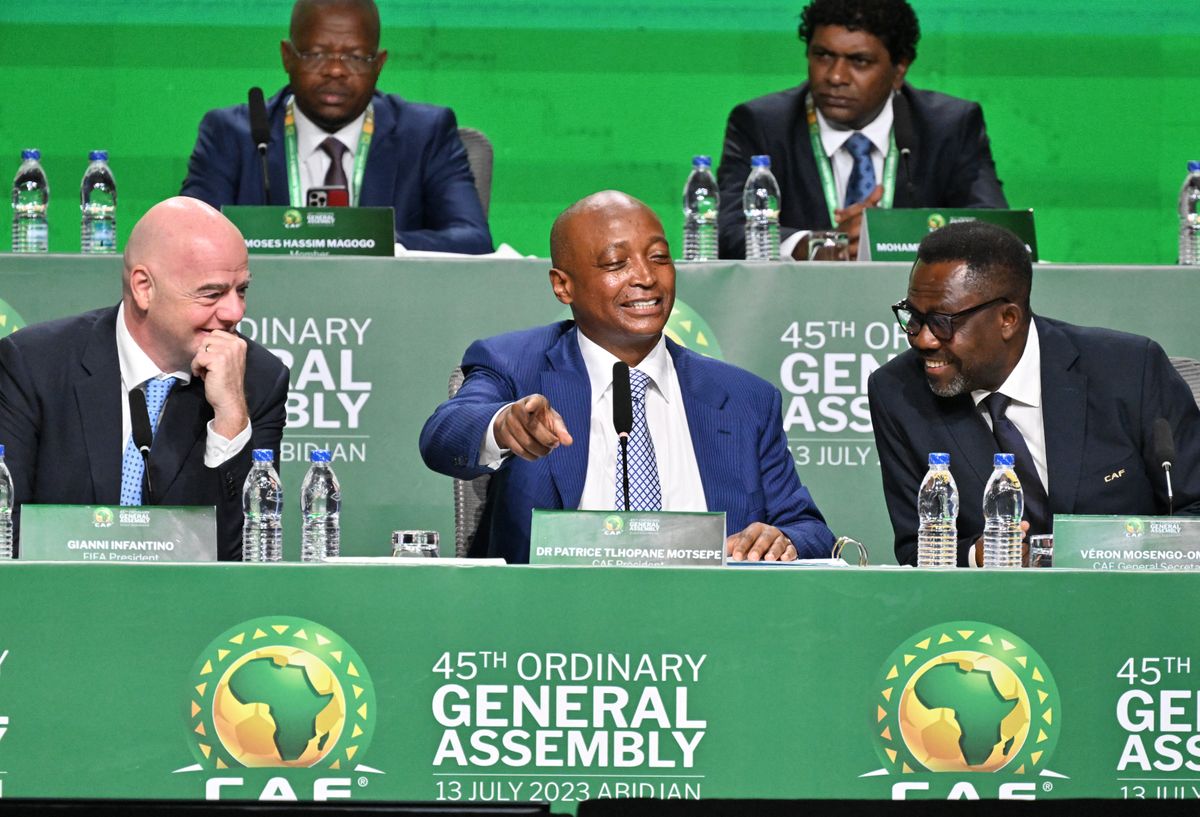 FIFA president Gianni Infantino (L), African Confederation of Football (CAF) president Patrice Motsepe (C) and CAF secretary general Veron Mosengo Omba (R) attend the CAF 45th Ordinary General Assembly in Abidjan in Ivory Coast on July 13, 2023. (Photo by Issouf SANOGO / AFP)